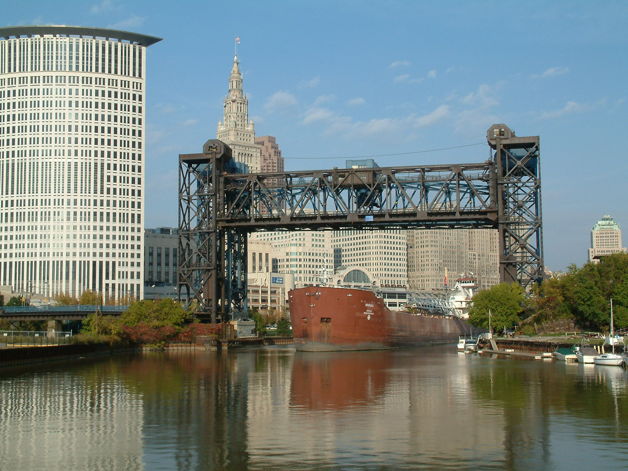 A freighter passes under Cuyahoga River lift bridges