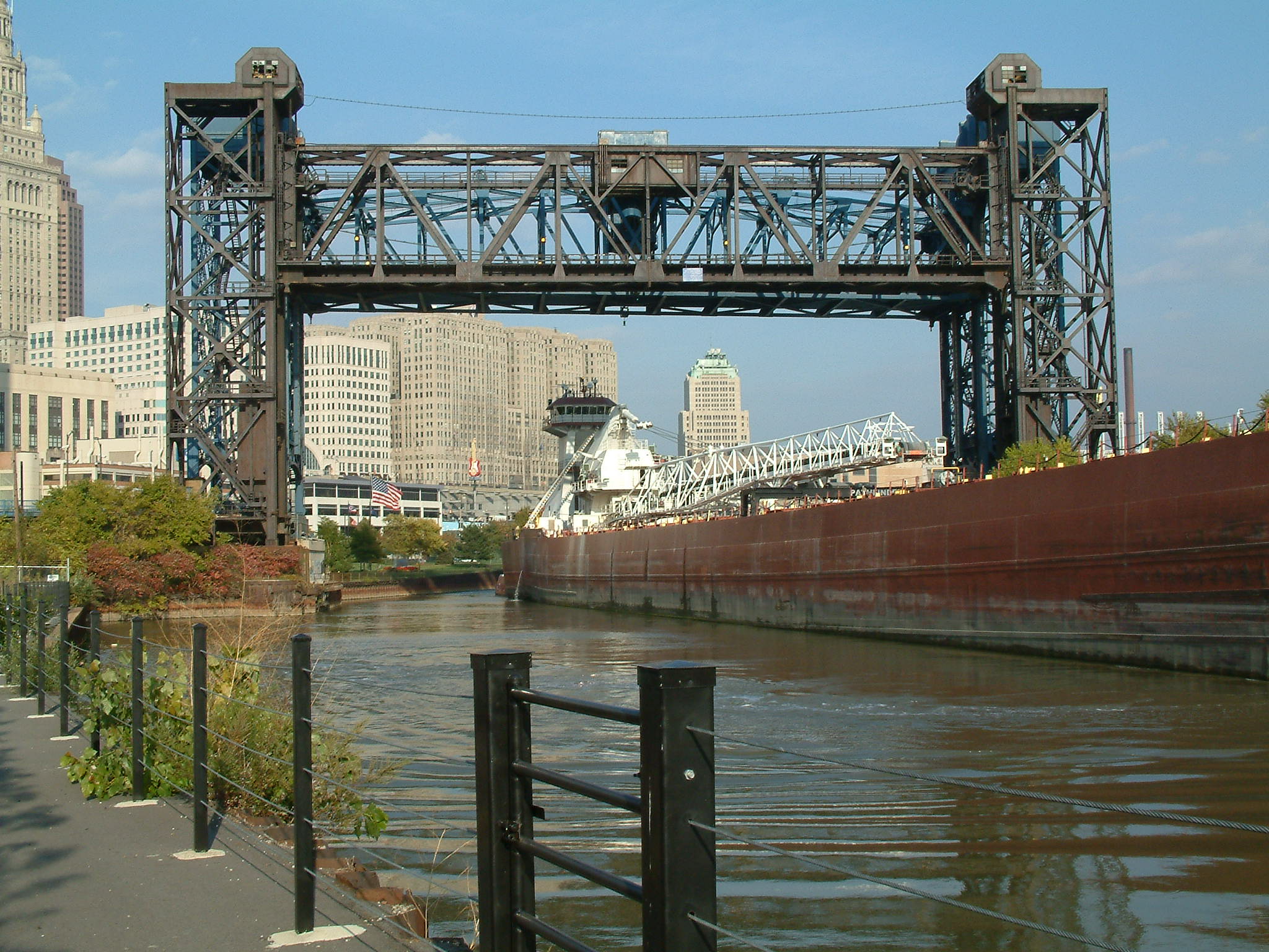 A freighter passes under a Cuyahoga River lift bridge